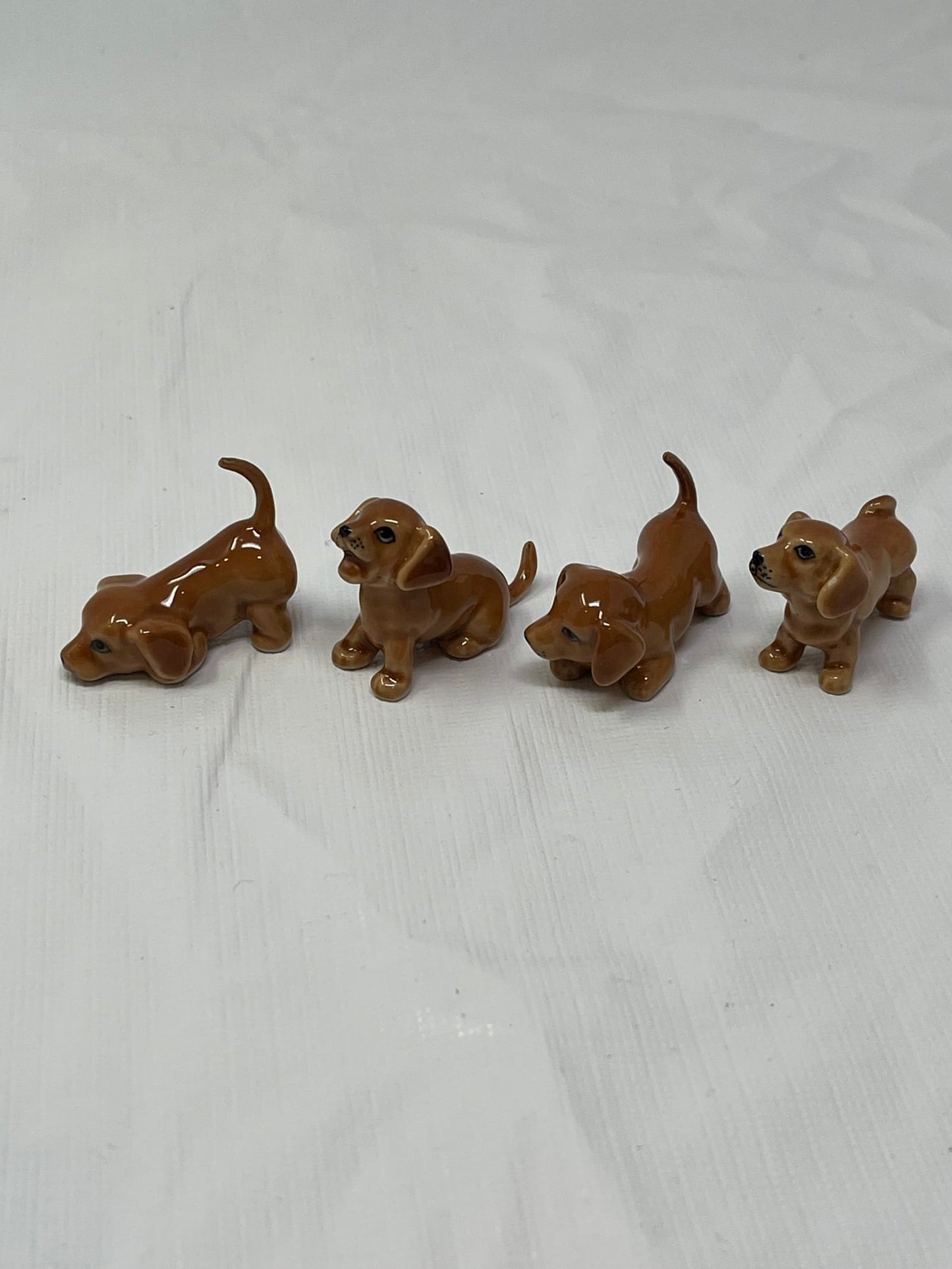 Set of 4 Miniature Ceramic Puppy Figurines – Brown, Hand-Painted