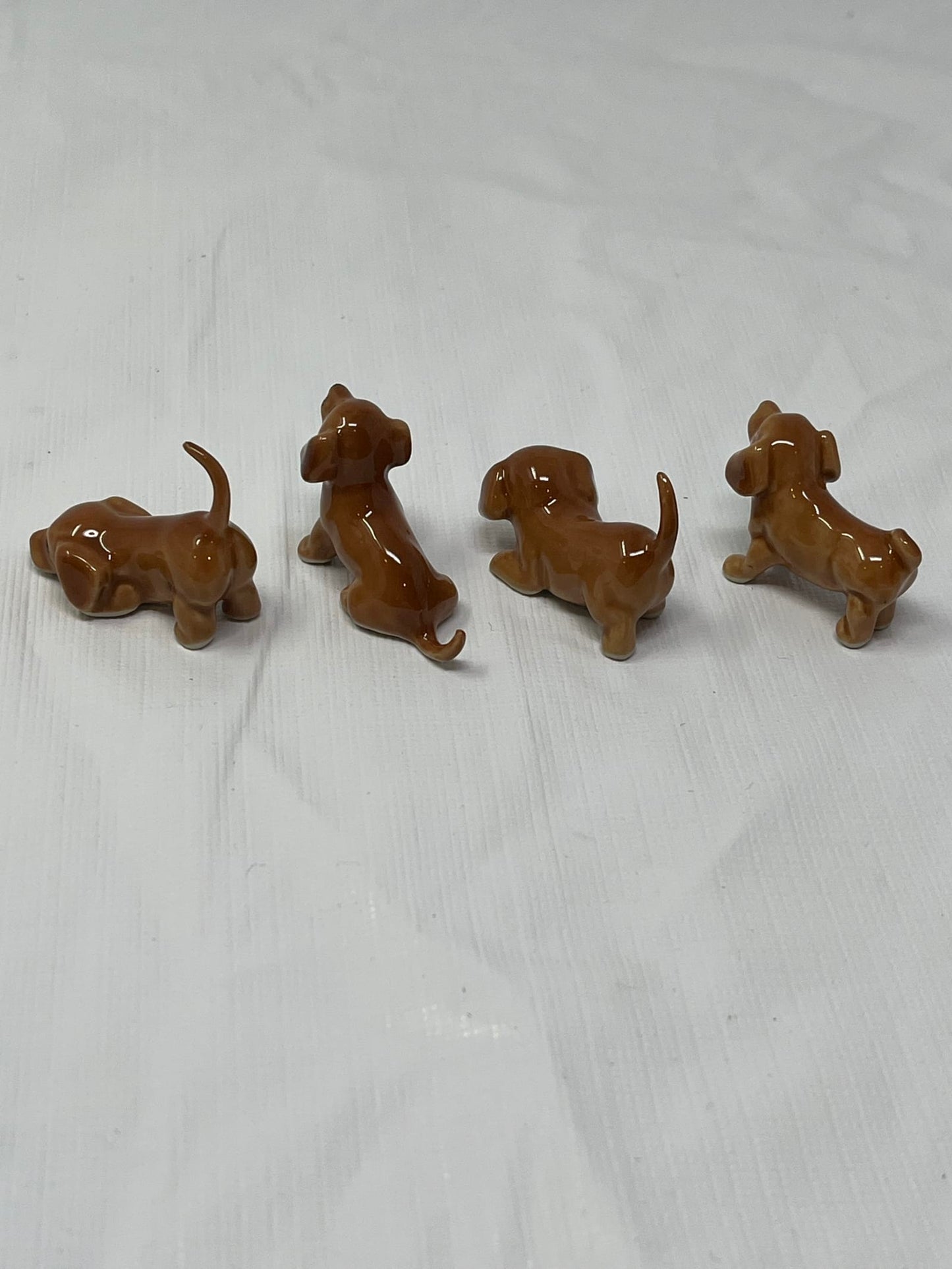 Set of 4 Miniature Ceramic Puppy Figurines – Brown, Hand-Painted
