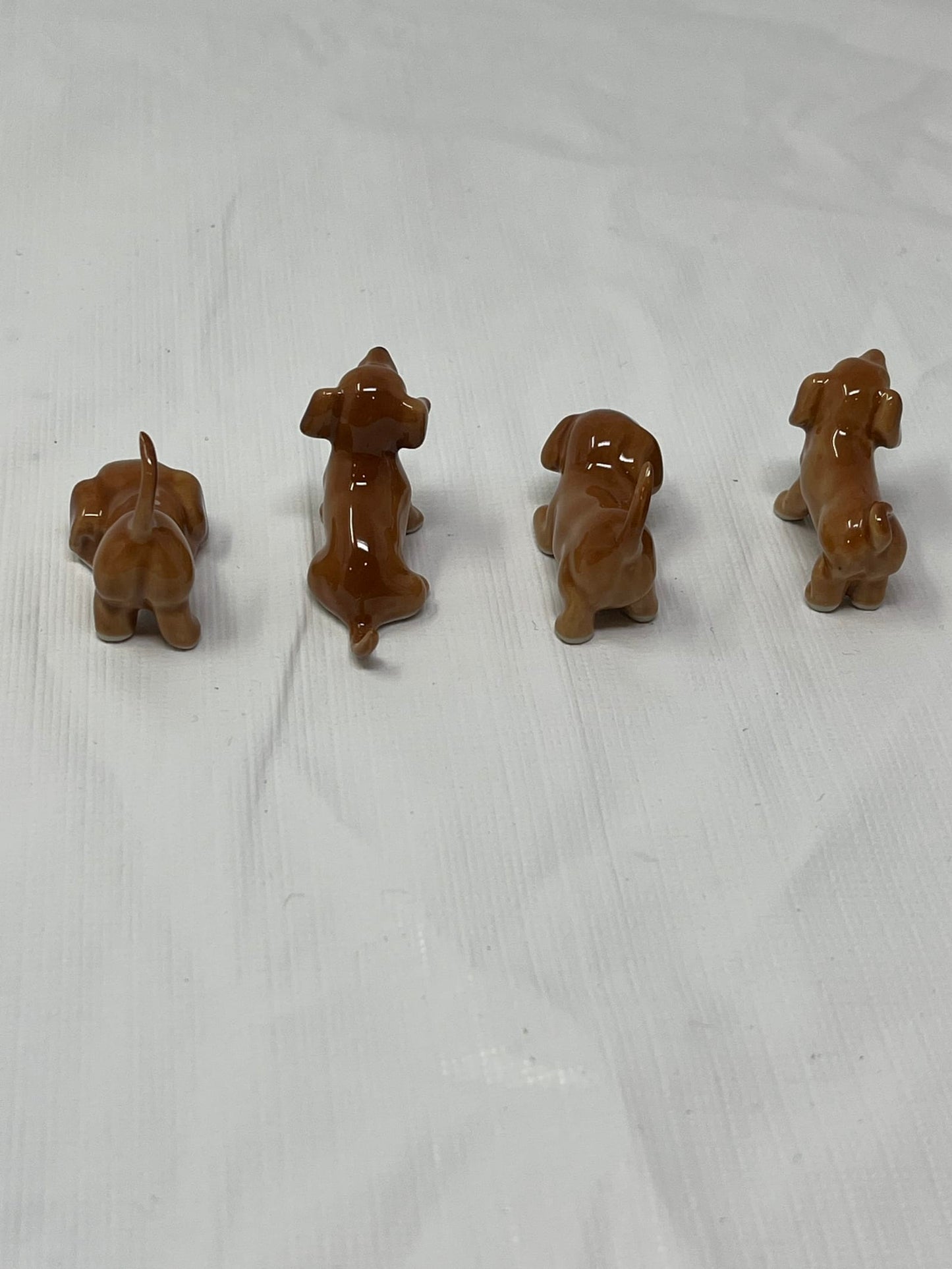 Set of 4 Miniature Ceramic Puppy Figurines – Brown, Hand-Painted